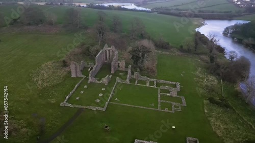 Drone shot of the ancient ruins of Inch Abbey, Downpatrick, County Down, Northern Ireland, United Kingdom, UK, established in the 12th Century and built by the Norman invader John de Courcy.