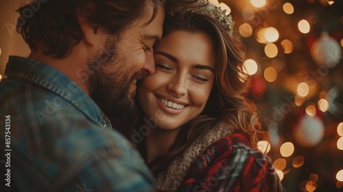 A couple warmly embracing each other with soft smiles on their faces, against a festive Christmas light background, capturing a moment of love and joy in the holiday season. © svastix