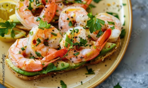 Wallpaper Mural Shrimp and avocado toast with herbs on a pastel yellow plate Torontodigital.ca