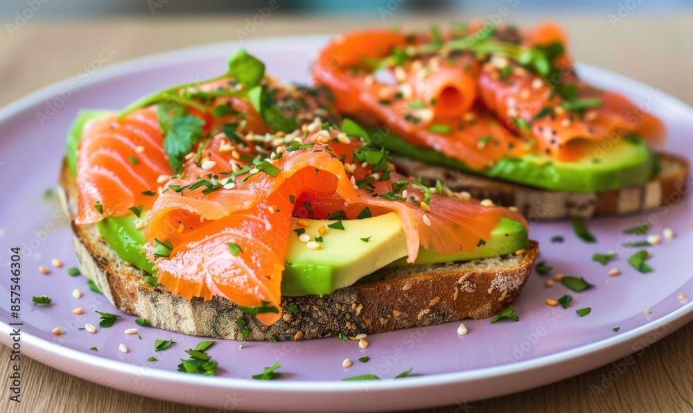 Avocado and salmon toast on a pastel purple plate Avocado and salmon toast on a pastel purple plate