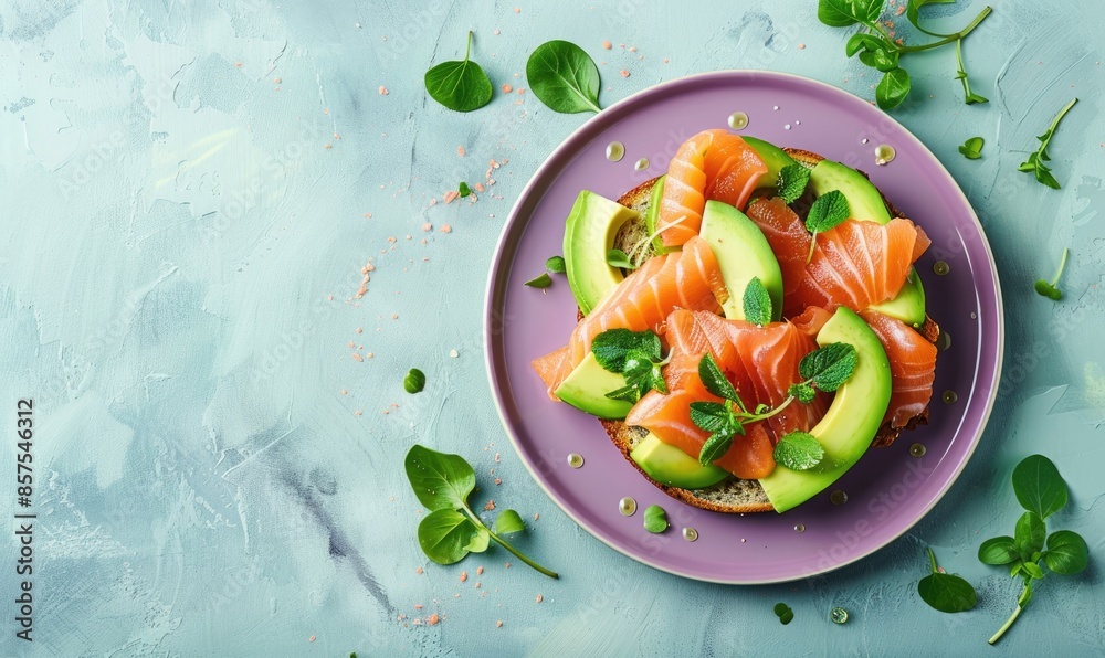Avocado and salmon toast on a pastel purple plate Avocado and salmon toast on a pastel purple plate