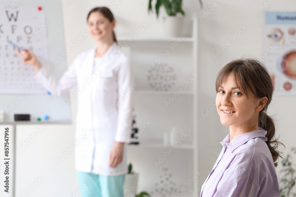 Young woman checking eyesight in clinic, closeup Young woman checking eyesight in clinic, closeup
