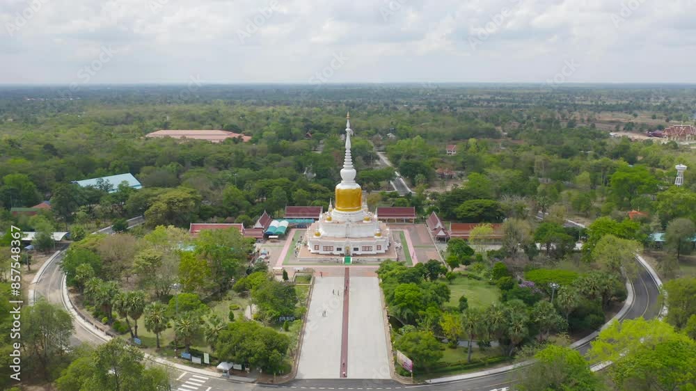 Phra That Na Dun temple pagoda is a buddhist temple in Maha Sarakham, an urban city town, Thailand. Thai architecture landscape background. Tourist attraction landmark. Phra That Na Dun temple pagoda is a buddhist temple in Maha Sarakham, an urban city town, Thailand. Thai architecture landscape background. Tourist attraction landmark.