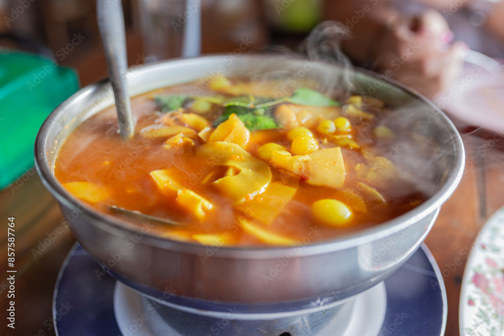 hot sour curry with pickled bamboo shoots and Ryukyu fish roe in metal pot, Asian food culture, Thai traditional food hot sour curry with pickled bamboo shoots and Ryukyu fish roe in metal pot, Asian food culture, Thai traditional food