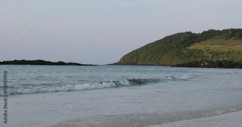 sea water waves at Hamdeok beach in Jeju island, South Korea sea water waves at Hamdeok beach in Jeju island, South Korea
