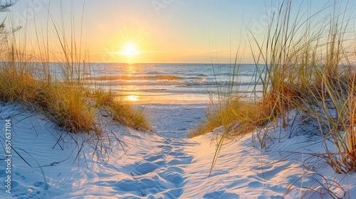 A beach scene with a sunset in the background