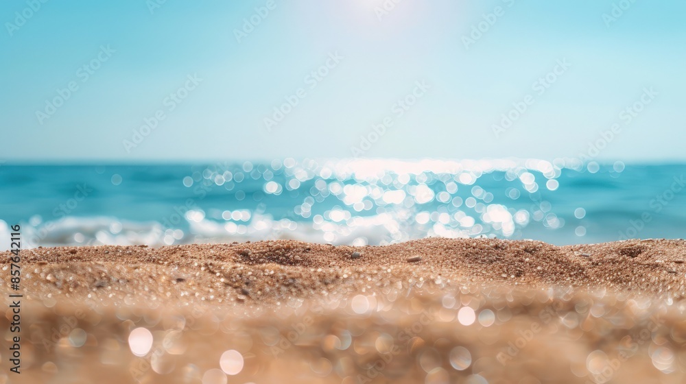 A beach scene with a blue ocean and a sandy beach A beach scene with a blue ocean and a sandy beach