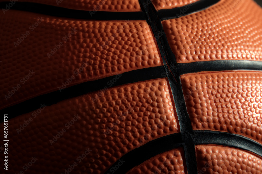 Obraz premium Detailed dark texture of official leather basketball. Streetball and hoops. Professional sports backgrounds
