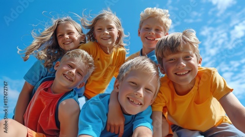 A group of children are smiling and posing for a picture