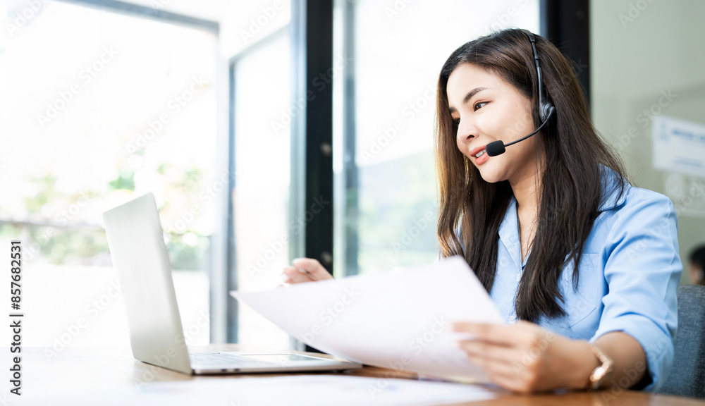 Portrait of female call center worker was smiling at office. Portrait of female call center worker was smiling at office.