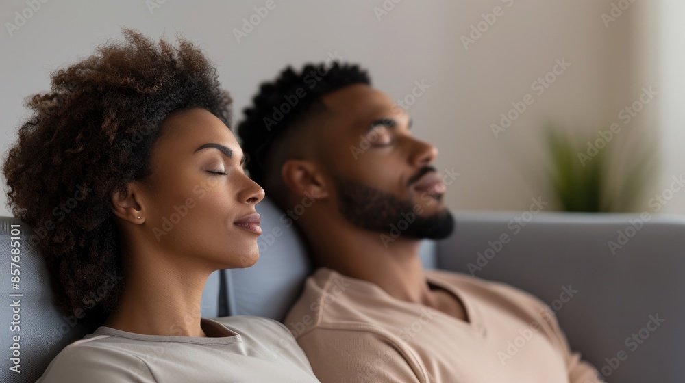 a couple sitting on a sofa in a counseling room, side by side with their eyes closed, in a counseling center a couple sitting on a sofa in a counseling room, side by side with their eyes closed, in a counseling center