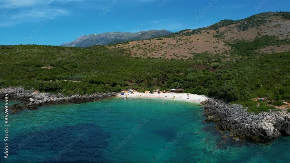 Ionian Coast Treasure: Secluded White Sand Beach Surrounded by Greenery and Emerald Waters, a Pearl of the Albanian Coastline Ionian Coast Treasure: Secluded White Sand Beach Surrounded by Greenery and Emerald Waters, a Pearl of the Albanian Coastline