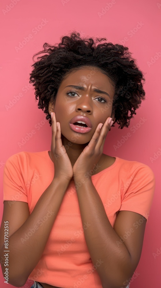 A young woman with curly hair looks surprised A young woman with curly hair looks surprised