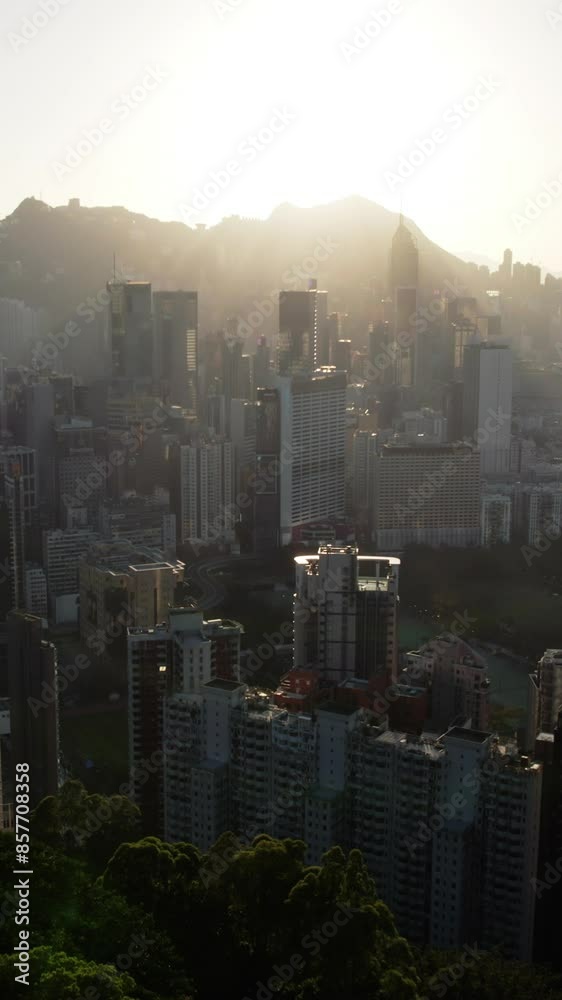 Aerial scenery view of Hong Kong skyscrapers skyline with Victoria Harbour at sunset. Aerial scenery view of Hong Kong skyscrapers skyline with Victoria Harbour at sunset.