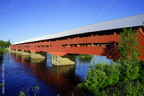 Red covered bridge across the Coulonge River in western Quebec photo