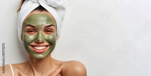 A woman with a green face mask on her face photo