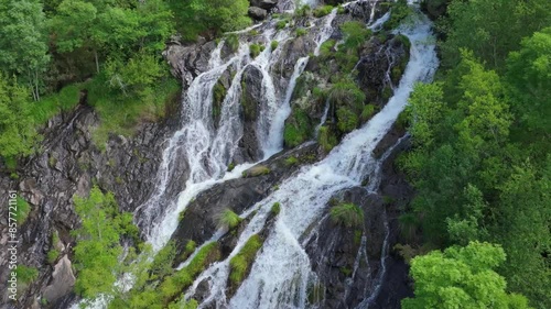 Steep Rock Mountains With Flowing Cascades In Toques, Mellid, Galicia, Spain. Aerial Shot photo