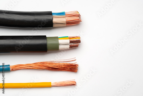 Various Electrical Wires With Exposed Copper Strands on White Background