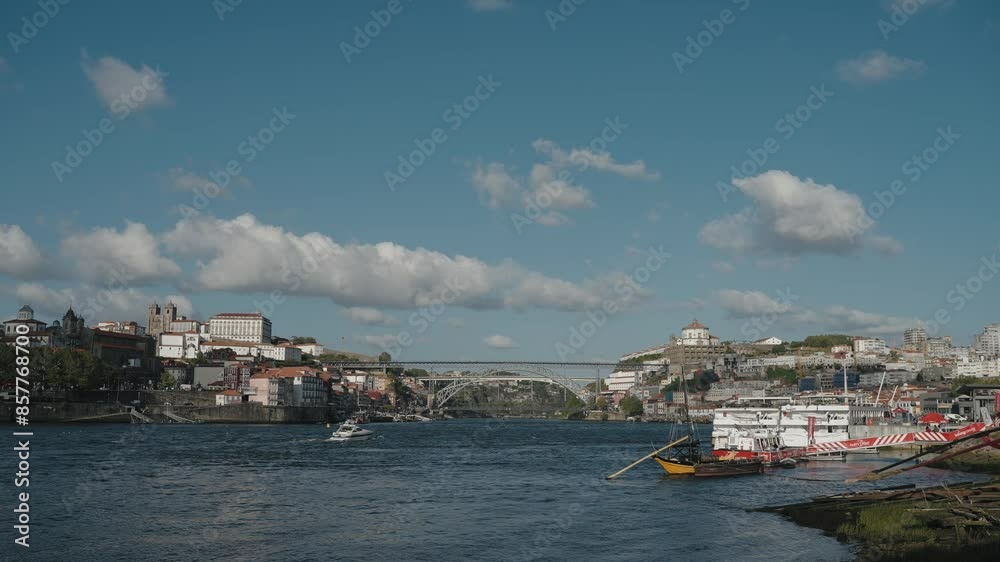 Wide view of the Douro River with boats and the Dom Luís I Bridge, Porto, Portugal Wide view of the Douro River with boats and the Dom Luís I Bridge, Porto, Portugal