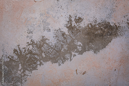 Worn out wall with peeling paint and faded colors. thin wall cracks,