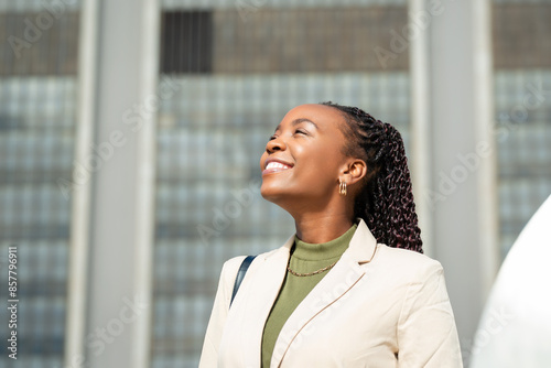 Confident Black Businesswoman Smiling Outdoors in Urban Setting