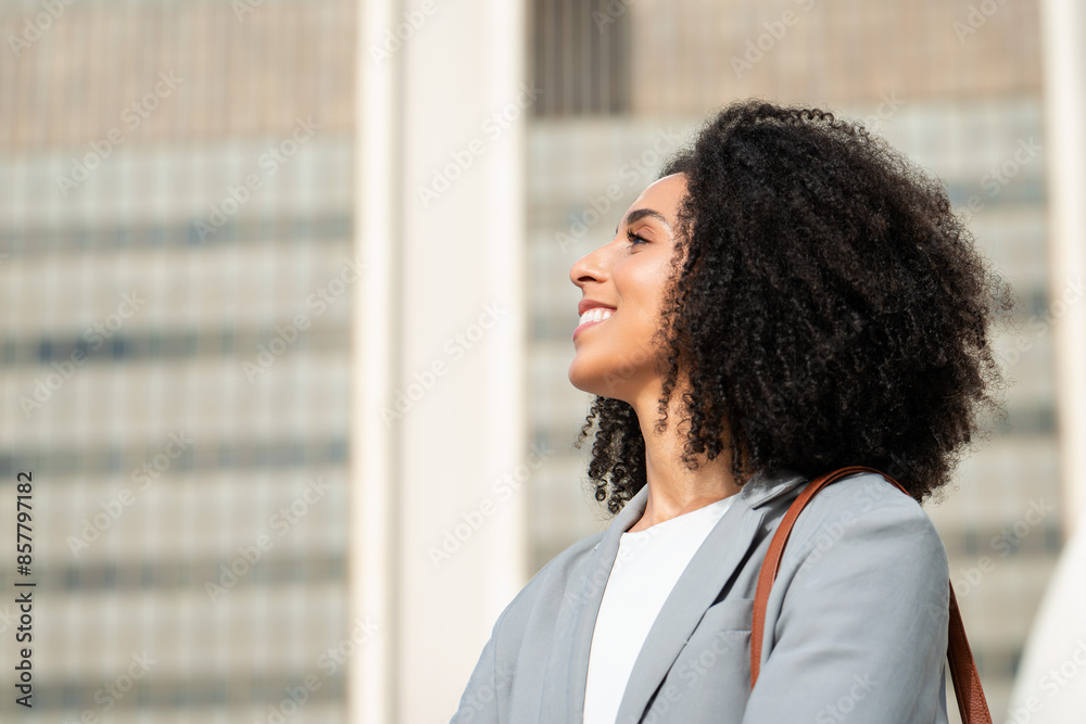 Confident Black Businesswoman Looking Up in Cityscape, Embracing Success and Opportunities Confident Black Businesswoman Looking Up in Cityscape, Embracing Success and Opportunities