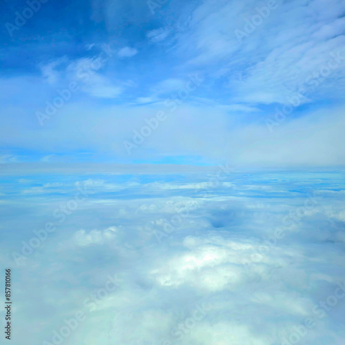 Snowy white clouds in the blue sky on a bright summer day big white clouds textured sky Scenery of fluffy white clouds Wide blue sky natural background.