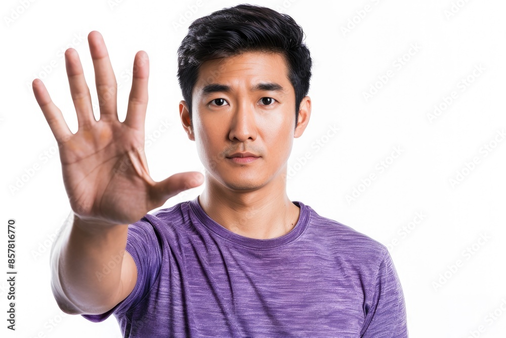 Man with Serious Expression Holding Up His Hand Man with Serious Expression Holding Up His Hand