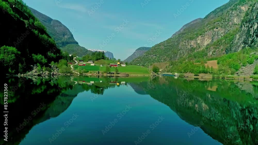 Mountains And Village Reflected On Fjord In Aurland, Norway - Aerial Drone Shot Mountains And Village Reflected On Fjord In Aurland, Norway - Aerial Drone Shot