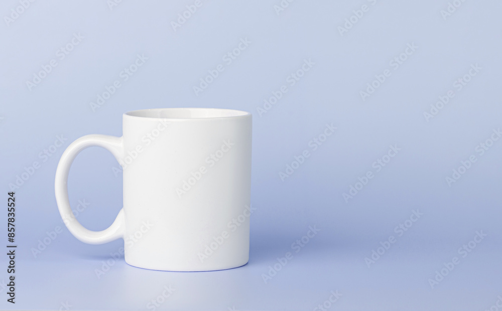 Fototapeta premium white cup for tea or coffee on a violet, purple background