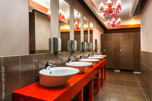 Interior of public washroom in restaurant with vintage red chandeliers