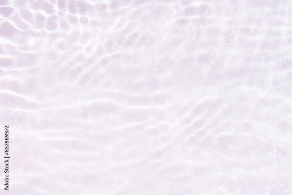 Obraz premium White water with ripples on the surface. Defocus blurred transparent white colored clear calm water surface texture with splashes and bubbles. Water waves with shining pattern texture background.