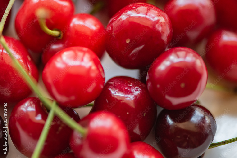On the plate and the cherry in hand