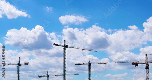 aerial view of the construction site with tall cranes 	(timelapse)