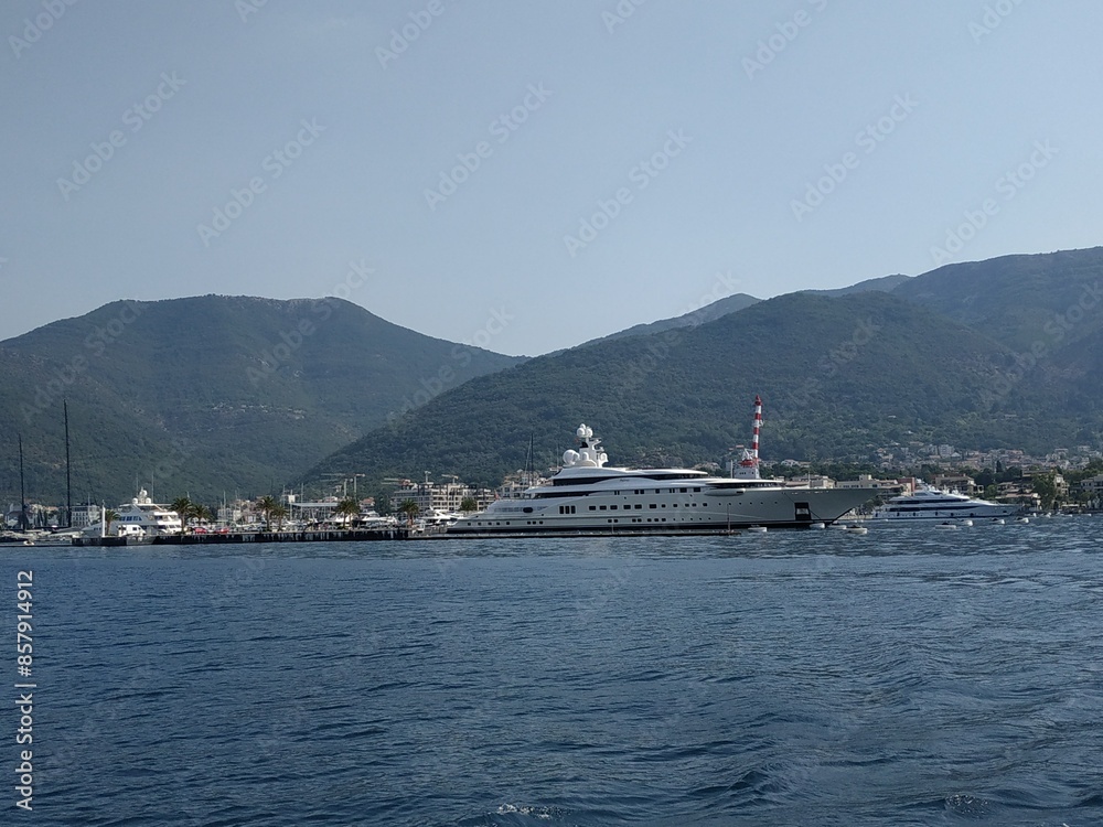 Landscape horizon viewpoint horizontal photography. Concept of Summer vacation trip. Montenegro. Yachts and mountains on the back. Copy space. Landscape horizon viewpoint horizontal photography. Concept of Summer vacation trip. Montenegro. Yachts and mountains on the back. Copy space.