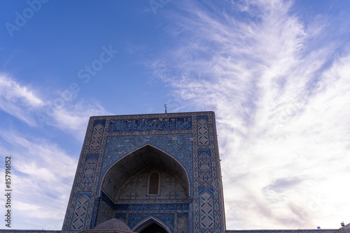 A blue and white building with a blue archway photo