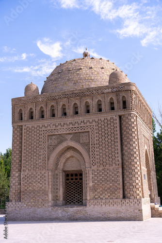 A large building with a dome on top. The building is brown and has a lot of detail photo