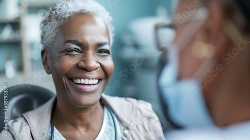 Close-up of a senior African American woman smiling warmly while discussing dental care options with her dentist in a modern dental clinic. Ai generated photo
