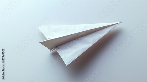 white paper plane on white ...
