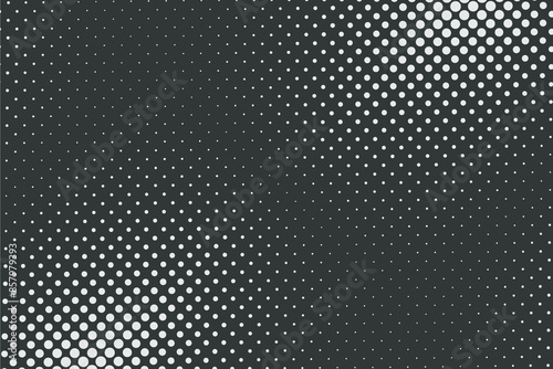 Halftone light dots on dark background dotted pattern vector