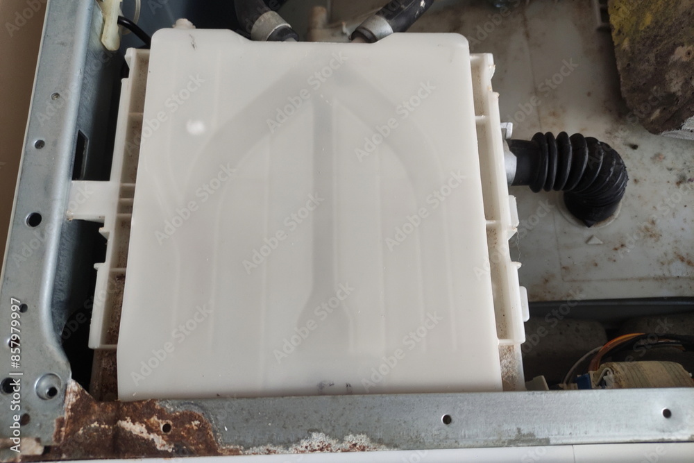 Old washing machine powder container under cap close up