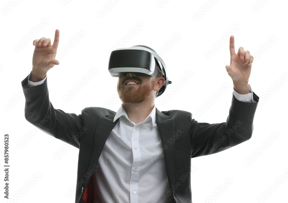 Smiling man using virtual reality headset while sitting in office chair on white background Smiling man using virtual reality headset while sitting in office chair on white background