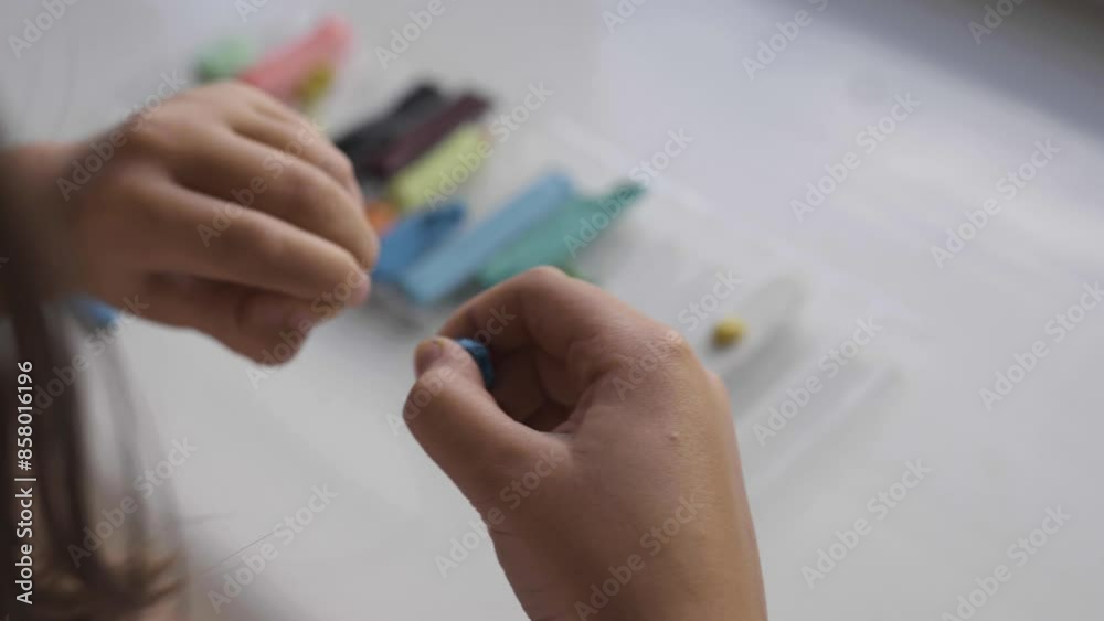 Hands playing with plasticine closeup. Preschooler motor skills of hands development. Art and education concept. Children creativity.
