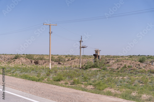Canvas Print A rural area with a dirt road and a few trees