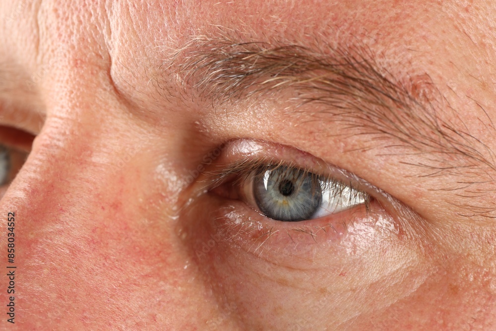 Macro photo of man with beautiful blue eyes Macro photo of man with beautiful blue eyes