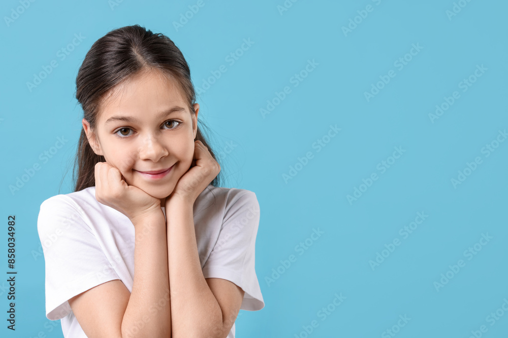 Portrait of beautiful girl on light blue background, space for text Portrait of beautiful girl on light blue background, space for text