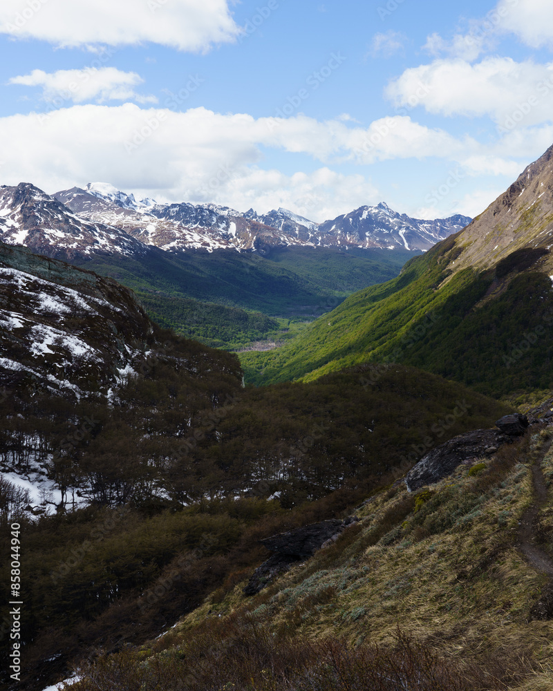 The view of Andean mountains with little snow and a green valley on the way to the Sheep Pass, Ushuaia - Argentina, Paso de la Oveja The view of Andean mountains with little snow and a green valley on the way to the Sheep Pass, Ushuaia - Argentina, Paso de la Oveja