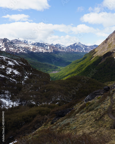 Fototapeta Naklejka Na Ścianę i Meble -  The view of Andean mountains with little snow and a green valley on the way to the Sheep Pass, Ushuaia - Argentina, Paso de la Oveja