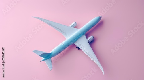 The airplane on pink background photo