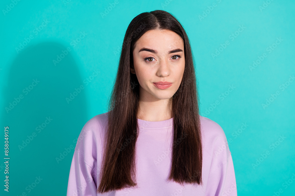 Photo portrait of attractive young woman look camera skeptical dressed stylish violet clothes isolated on aquamarine color background Photo portrait of attractive young woman look camera skeptical dressed stylish violet clothes isolated on aquamarine color background